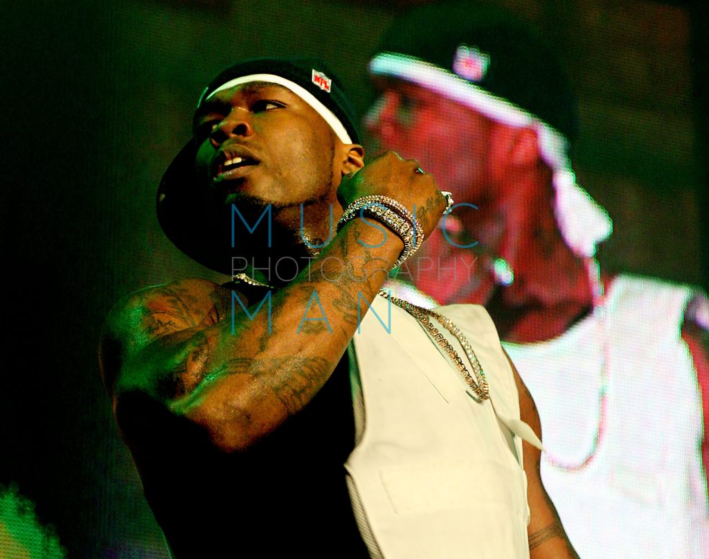 50 Cent performing live on stage captured by Music Man Photography.