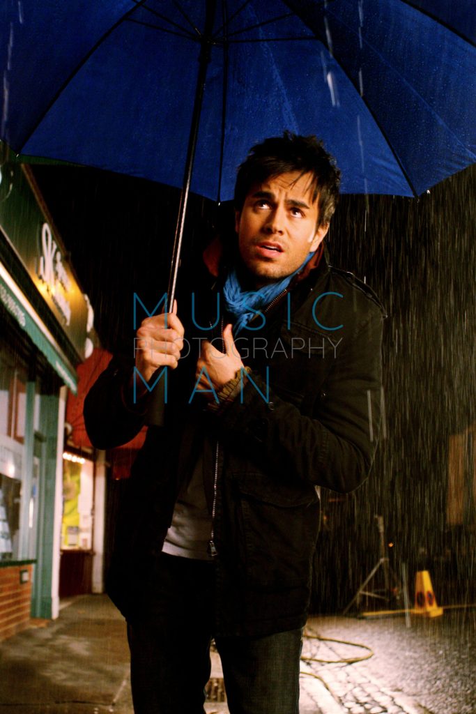 Enrique Iglesias behind the scenes during a candid moment on set in Dulwich Village, South London.