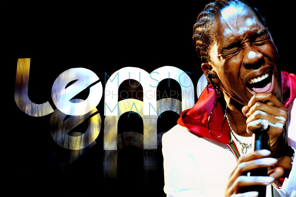 Lemar performing live on stage in an iconic concert moment by Music Man Photography.
