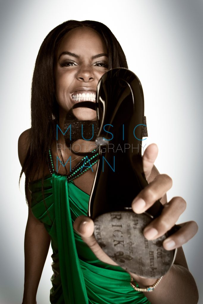 Destiny's Child singer Kelly Rowland snarling behind a black high heel stiletto during an exclusive, unreleased Blues and Soul Magazine studio portrait session, photography by Music Man Studio.