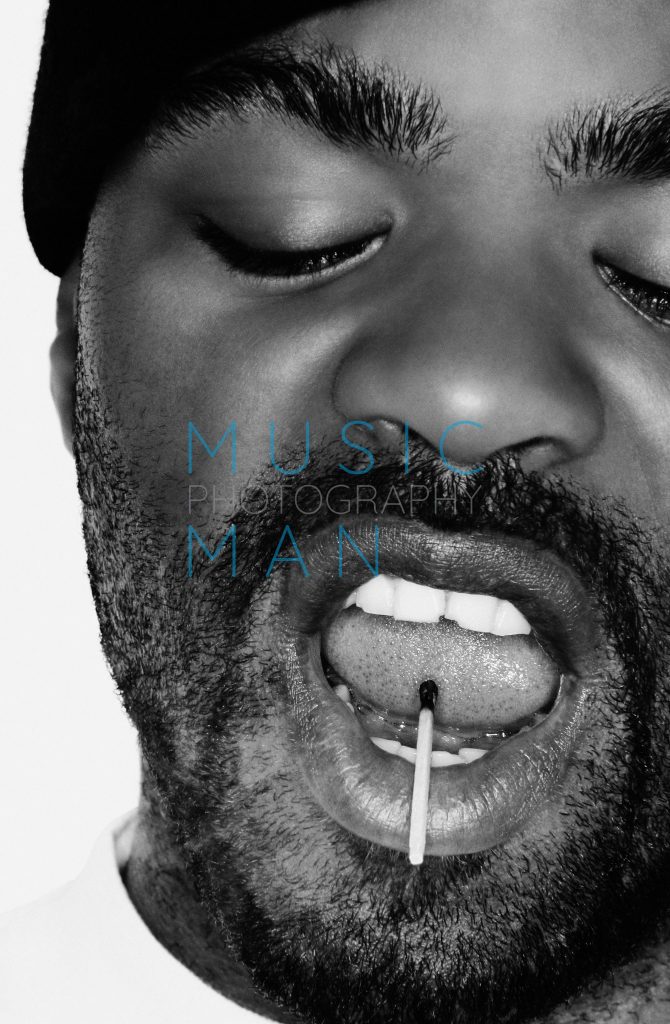 Method Man with a burnt matchstick resting on his tongue during an intimate close-up studio portrait session at the Sanderson Hotel in London, photography by Music Man Studio.