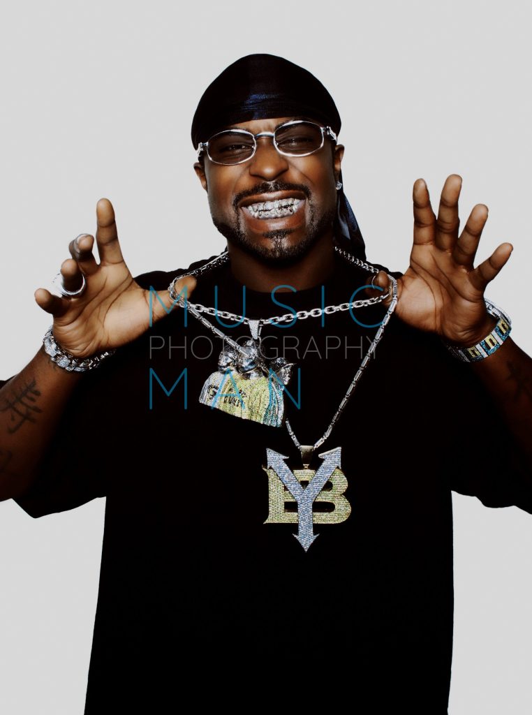 G-Unit rap artist Young Buck displaying diamond grills and heavy gold chains during an exclusive studio portrait session in London, photography by Music Man Studio.